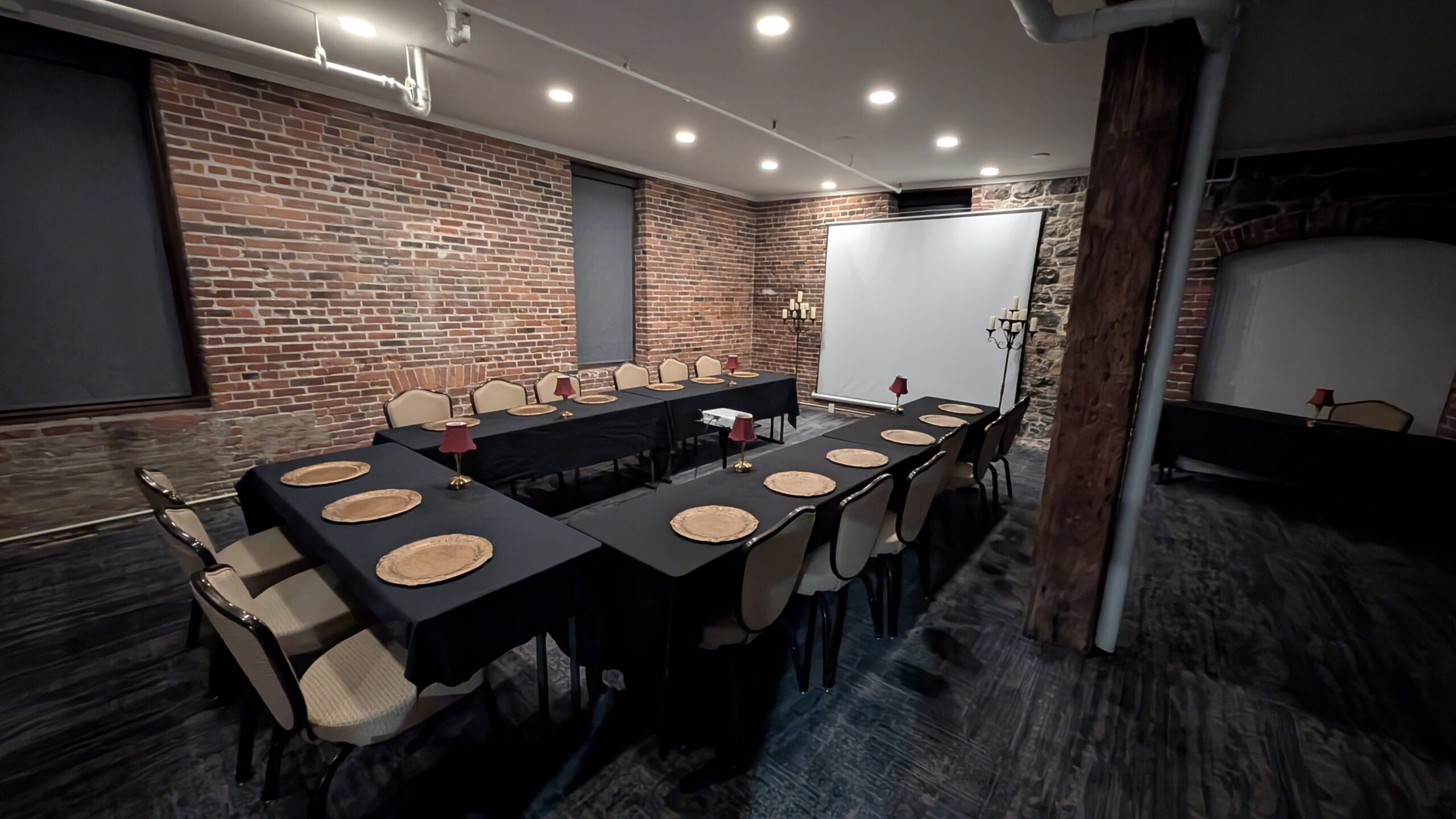 The soft lit dining space set for the evening